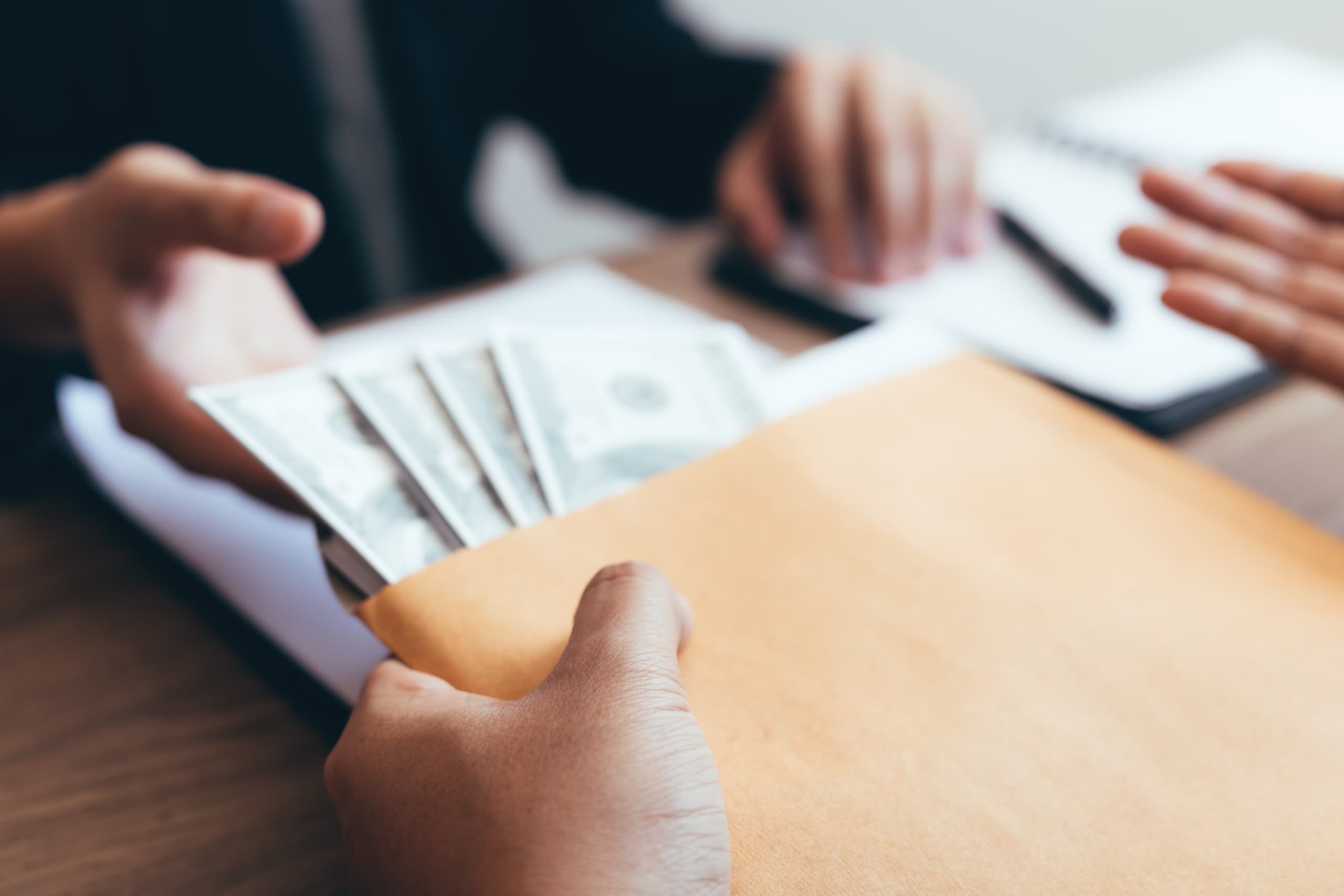 young couple arguing over debt